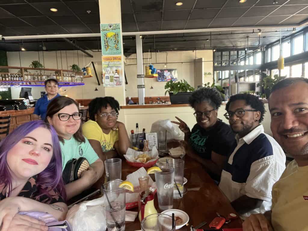 A group of coworkers sitting at a table