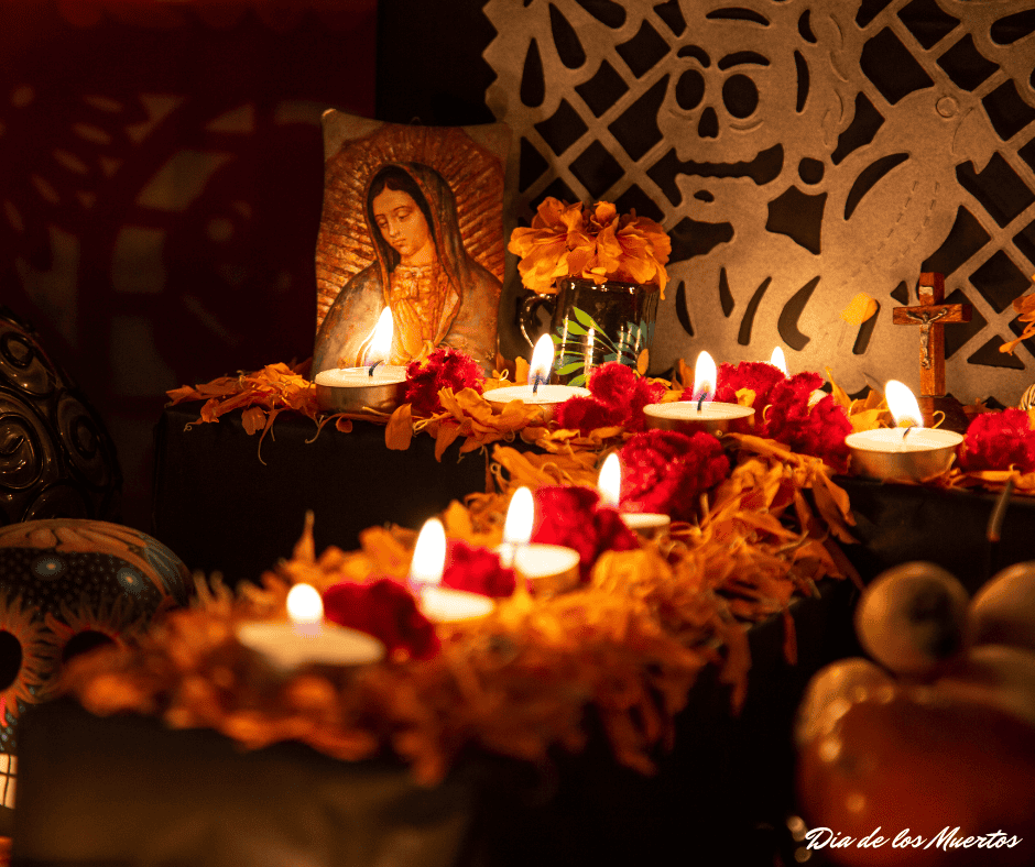 An example of an ofrenda with an image of the Virgin Mary, candles and flowers.