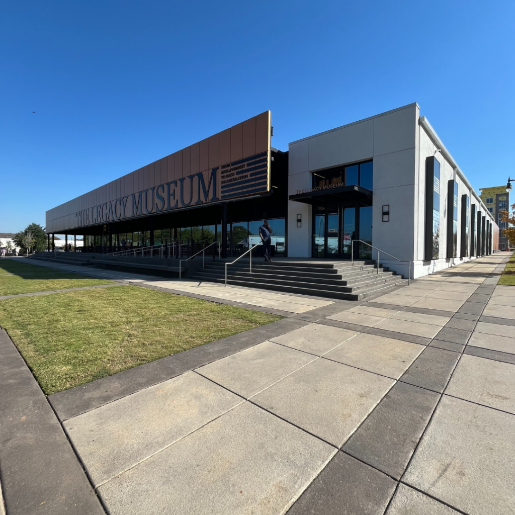 The front of the Legacy Museum in Montgomery, Alabama, on a sunny day.